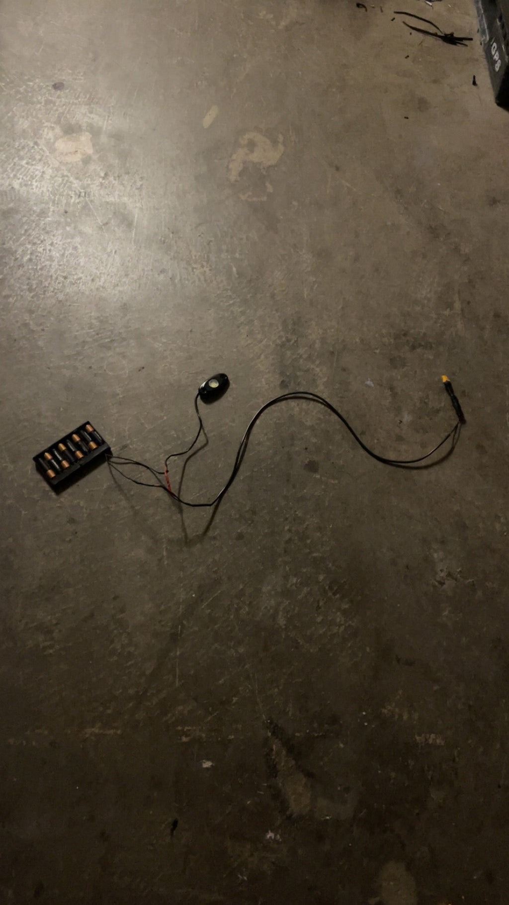 Hidden battery powered rock light switch
