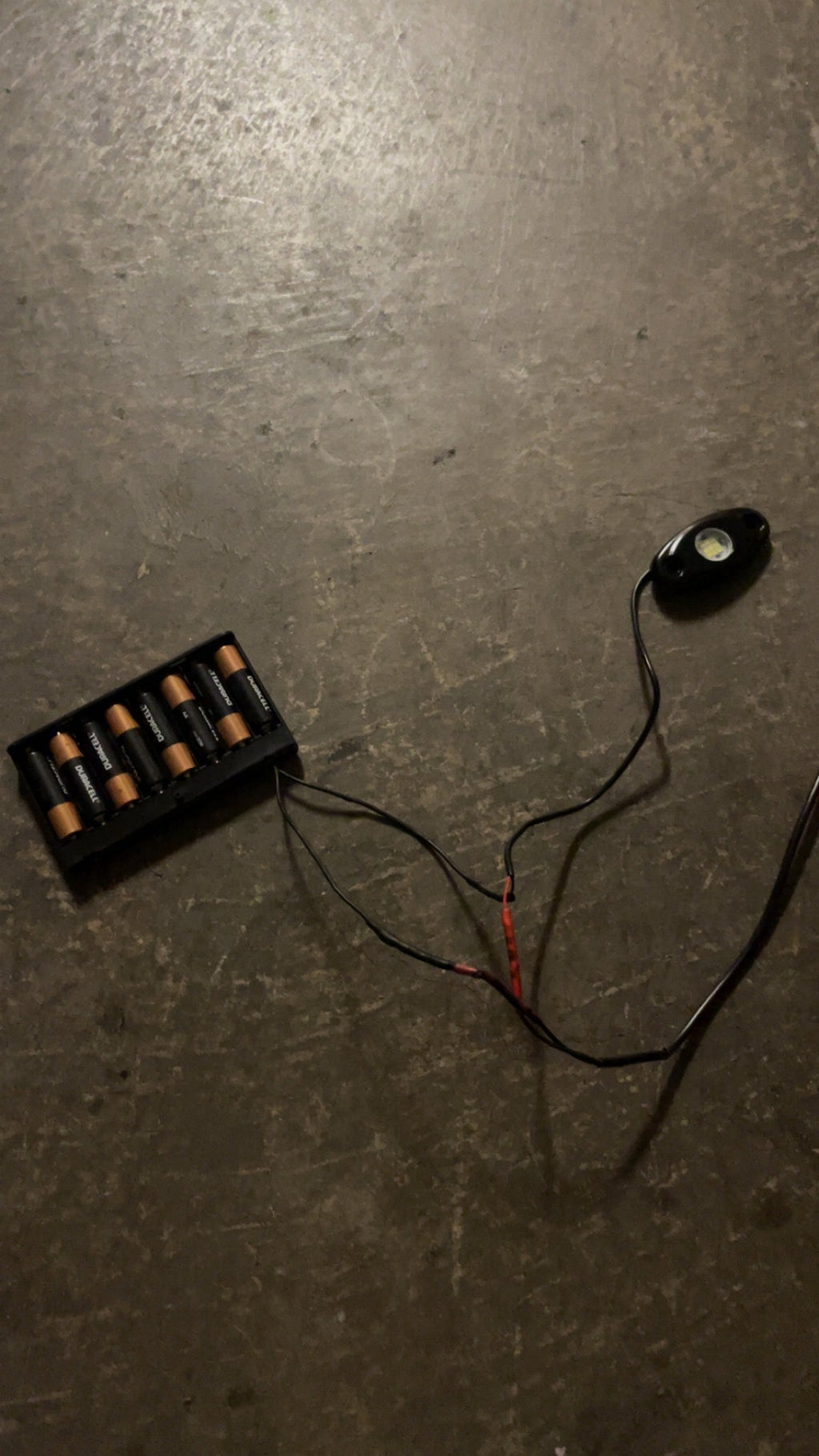 Hidden battery powered rock light switch